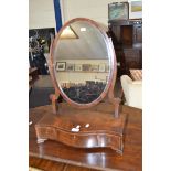 19TH CENTURY MAHOGANY DRESSING TABLE MIRROR WITH OVAL MIRROR PLATE OVER A SERPENTINE BASE WITH THREE