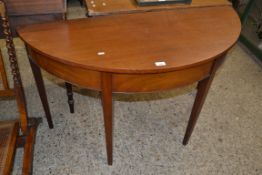 19TH CENTURY MAHOGANY DEMI-LUNE HALL TABLE RAISED ON TAPERING LEGS, 122CM WIDE