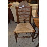 EARLY 20TH CENTURY RUSH SEAT LADDERBACK CHAIR, HEIGHT APPROX 94CM