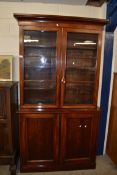 VICTORIAN MAHOGANY TWO PIECE BOOKCASE CABINET WITH MOULDED CORNICE OVER TWO GLAZED DOORS WITH