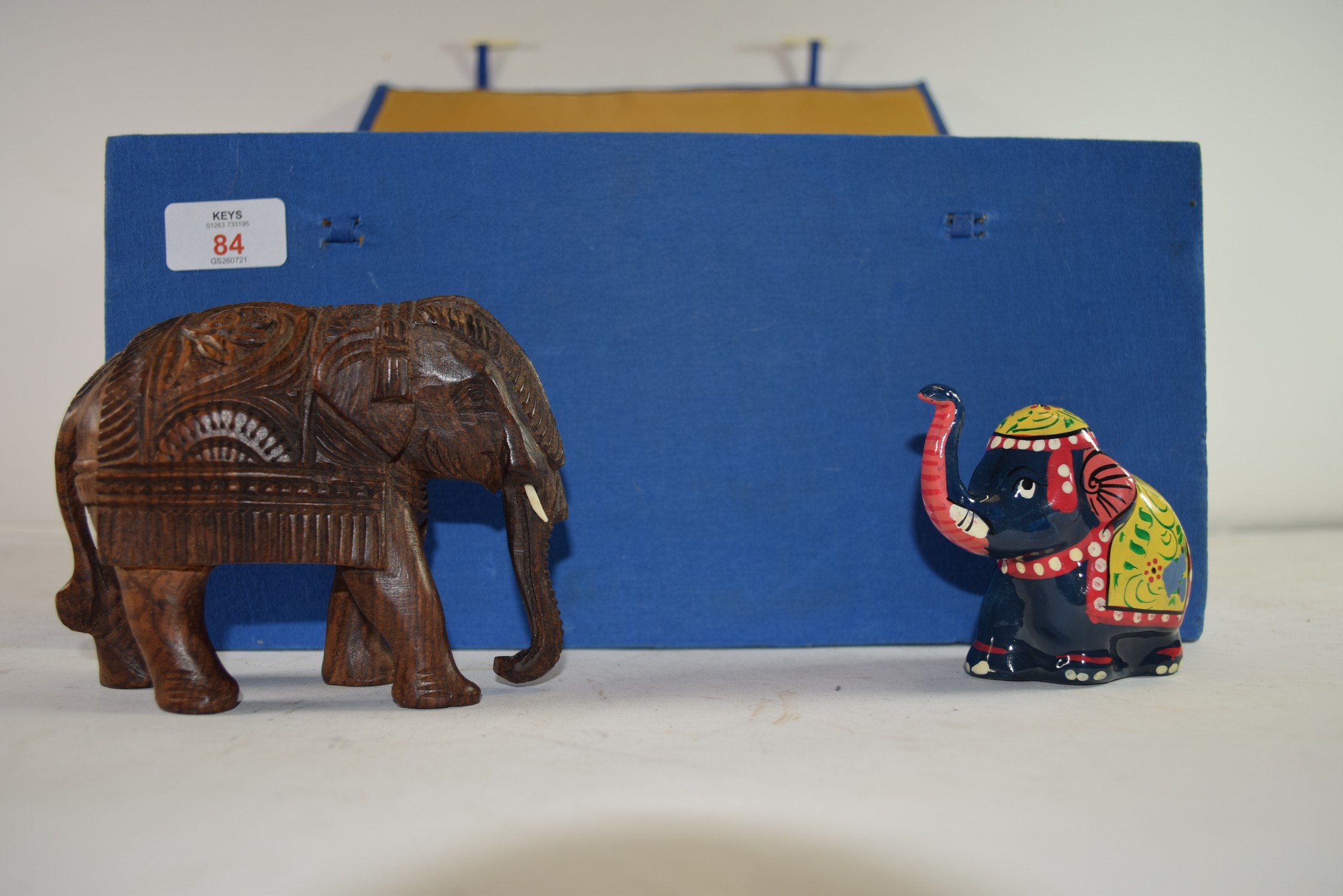 SMALL BOX CONTAINING VARIOUS BRASS, WOODEN AND COMPOSITION MODELS OF ELEPHANTS