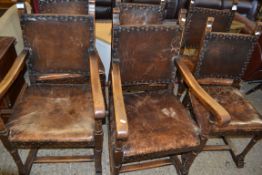 SET OF SIX EARLY 20TH CENTURY OAK FRAMED AND LEATHER UPHOLSTERED DINING CHAIRS TO INCLUDE TWO