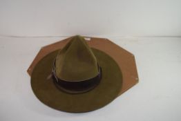 VINTAGE GREEN MILITARY WIDE BRIMMED HAT SET IN A WOODEN SURROUND