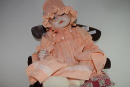 BYRON PORCELAIN HEADED DOLL SET ON SMALL DOLL'S CHAIR