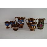 GROUP OF VICTORIAN COPPER LUSTRE GLAZED WARES COMPRISING FOUR JUGS, TWO GOBLETS AND A PEDESTAL BOWL