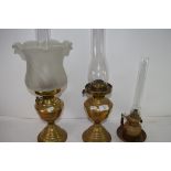 THREE VINTAGE BRASS BASED OIL LAMPS