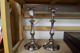 PAIR OF SILVER PLATED CANDLESTICKS WITH LOADED BASES