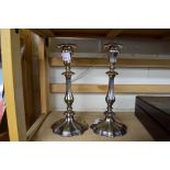 PAIR OF SILVER PLATED CANDLESTICKS WITH LOADED BASES