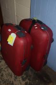 TWO RED HARD CASED SUITCASES