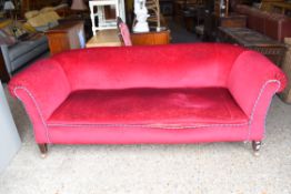 LARGE EARLY 20TH CENTURY RED VELOUR UPHOLSTERED SOFA, RAISED ON TAPERING SQUARE LEGS, 100CM WIDE
