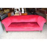 LARGE EARLY 20TH CENTURY RED VELOUR UPHOLSTERED SOFA, RAISED ON TAPERING SQUARE LEGS, 100CM WIDE