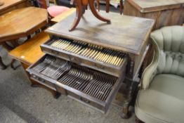 EARLY 20TH CENTURY OAK CUTLERY CANTEEN ON BARLEY TWIST LEGS FITTED WITH TWO DRAWERS CONTAINING A