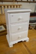 WHITE PAINTED THREE DRAWER BEDSIDE CABINET