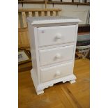 WHITE PAINTED THREE DRAWER BEDSIDE CABINET