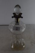 CUT CLEAR GLASS DECANTER OF WAISTED FORM FITTED WITH A SHEFFIELD HALLMARK SILVER COLLAR