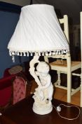 TABLE LAMP, THE PLASTER FINISH BASE FORMED AS A CHERUB, COMPLETE WITH SHADE