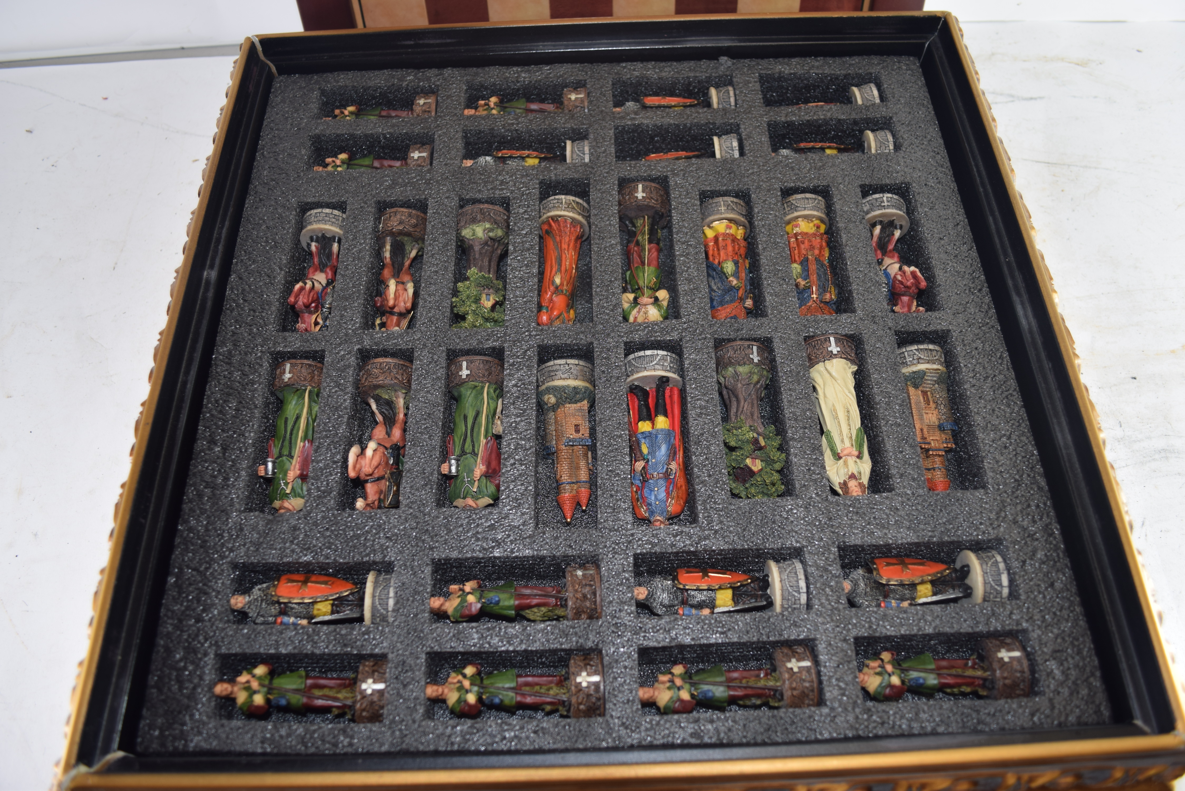 MODERN CHESS SET WITH COLOURED RESIN FIGURES AND A GILT SURROUNDED BOARD - Image 2 of 2