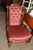 VICTORIAN BUTTON BACK VELOUR UPHOLSTERED NURSING CHAIR WITH SHOWOOD FRAME RAISED ON TURNED LEGS,