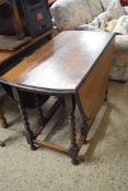 OVAL OAK DROP LEAF TABLE ON BARLEY TWIST LEGS