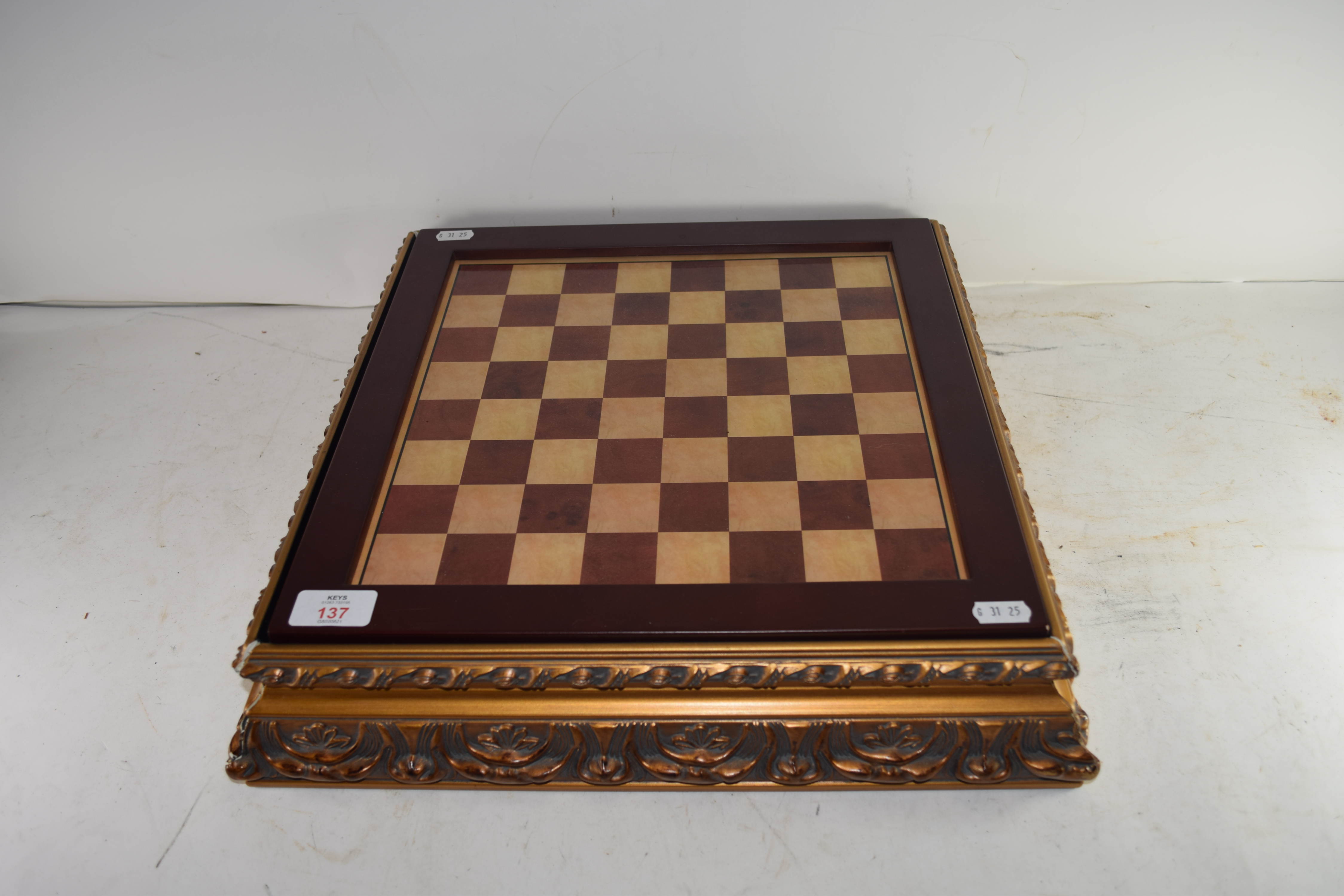 MODERN CHESS SET WITH COLOURED RESIN FIGURES AND A GILT SURROUNDED BOARD