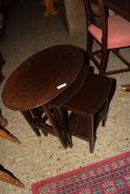 NEST OF THREE DARK STAINED TABLES, LARGEST 58CM WIDE