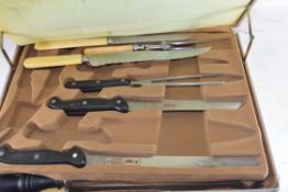 CASED GROUP OF VARIOUS CARVING KNIVES, STEAK KNIVES AND FORKS ETC, SOME APPEAR UNUSED