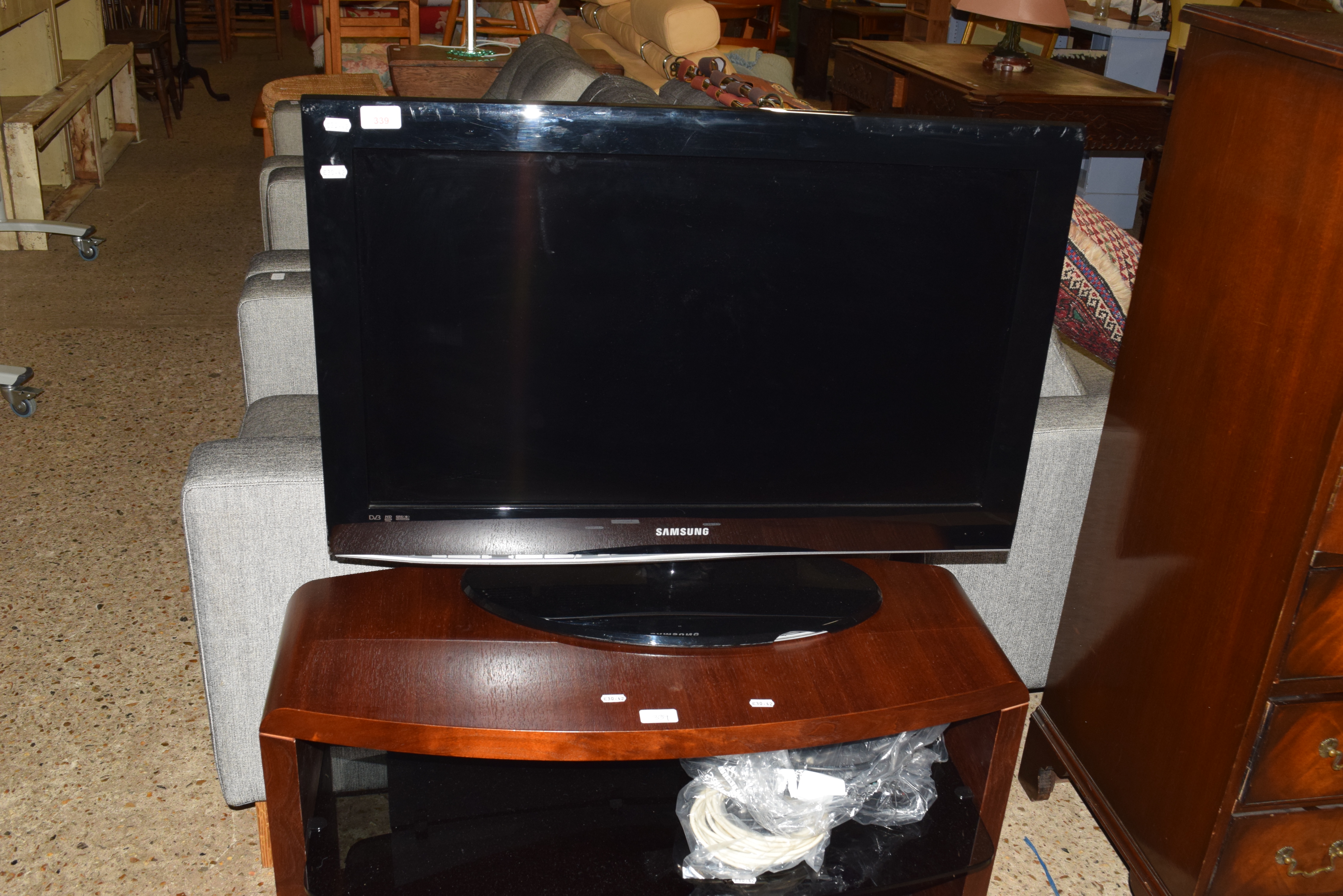 SAMSUNG FLATSCREEN TV ON WOOD FINISH STAND, 85CM WIDE