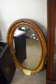 EARLY 20TH CENTURY OVAL BEVELLED WALL MIRROR IN DARK STAINED FRAME