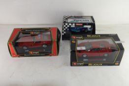 BOXED BURAGO BIJOUX COLLECTION MODEL CAR PLUS ANOTHER ONE SIMILAR AND A FURTHER CARRERA FORMULA 1