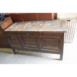 17TH CENTURY OAK COFFER WITH THREE PANELLED FRONT WITH CARVED DETAIL, OPENING TO A VOID INTERIOR,