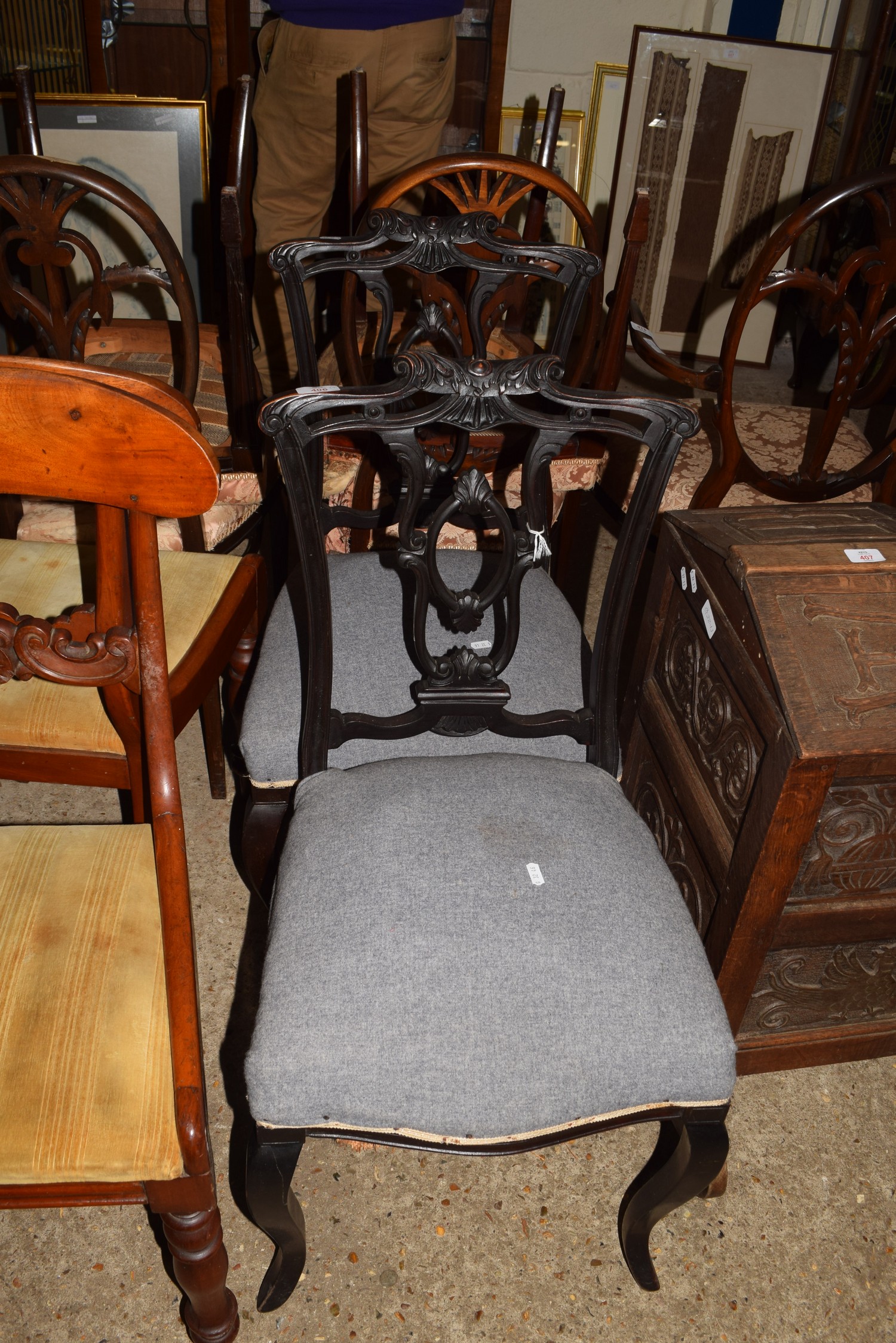PAIR OF LATE VICTORIAN SIDE CHAIRS WITH CARVED EBONISED BACKS, BLUE UPHOLSTERED SEATS AND CABRIOLE