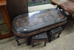 MID-20TH CENTURY CHINESE OR SOUTH EAST ASIAN OVAL COFFEE TABLE DECORATED WITH AN ELABORATE CARVED