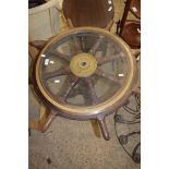 SHIPPING INTEREST, A NOVELTY WINE TABLE CONSTRUCTED FROM A SHIP'S WHEEL, THE CENTRE MARKED "