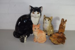 FOUR VARIOUS CERAMIC MODEL CATS AND A SQUIRREL NUT DISH