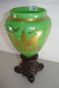 19TH CENTURY GREEN GLASS VASE DECORATED WITH BIRDS SET ON A CARVED BASE