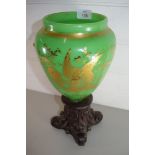 19TH CENTURY GREEN GLASS VASE DECORATED WITH BIRDS SET ON A CARVED BASE