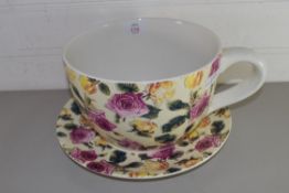 LARGE ROSE DECORATED OVER-SIZED CUP AND SAUCER