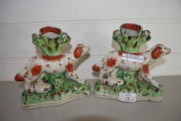 PAIR OF STAFFORDSHIRE VASES FORMED AS DOGS