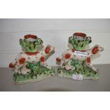 PAIR OF STAFFORDSHIRE VASES FORMED AS DOGS