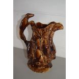 TREACLE GLAZE JUG DECORATED WITH DEAD GAME