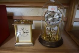 DOME TOP ANNIVERSARY CLOCK AND A QUARTZ OPERATED CARRIAGE CLOCK