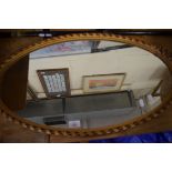 OVAL WALL MIRROR IN GILT DECORATED FRAME, 75CM HIGH