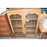 WALNUT VENEERED TWO-DOOR BOOKCASE OR DISPLAY CABINET