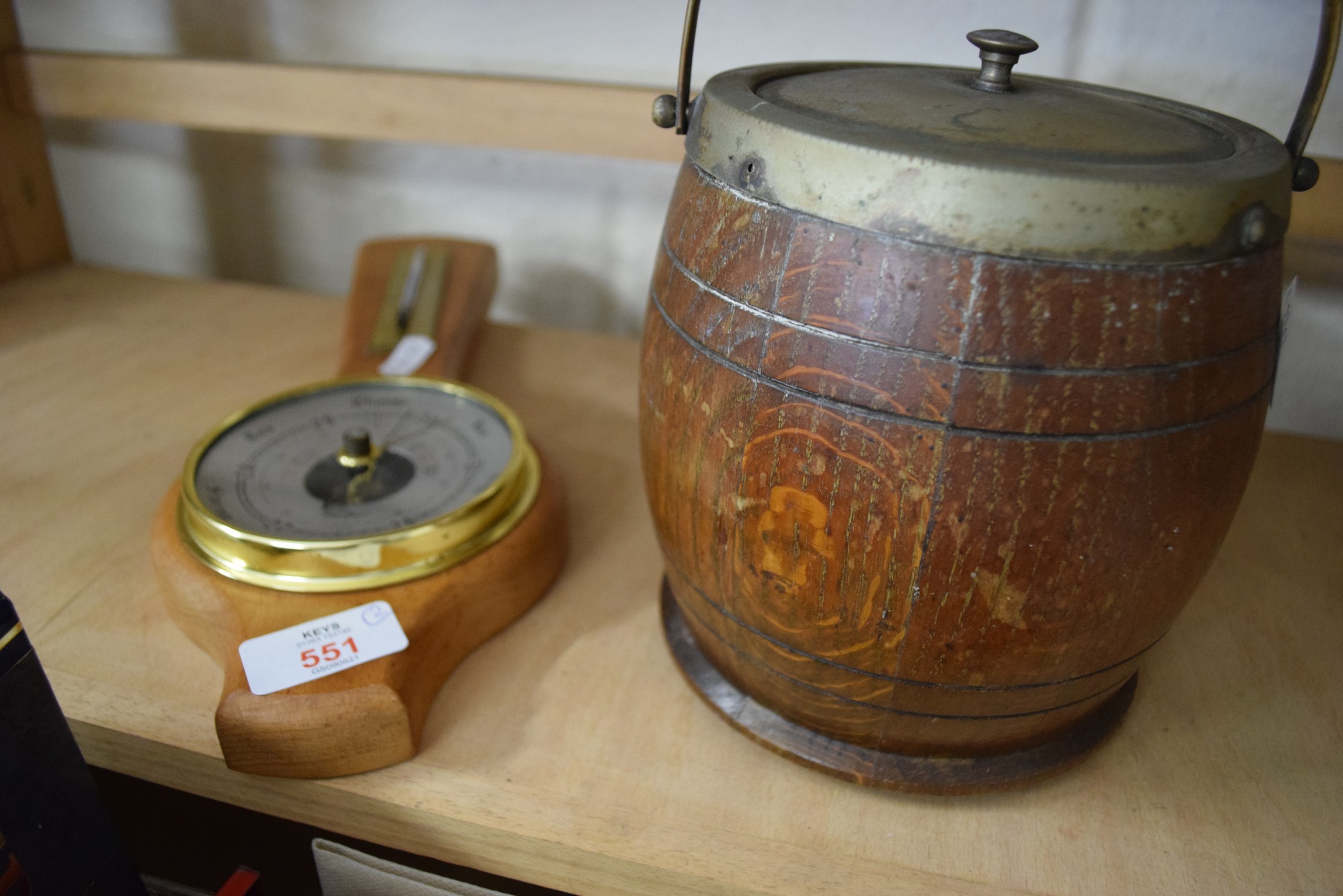 OAK BISCUIT BARREL AND A SMALL BAROMETER