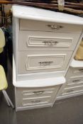 CREAM FINISH BEDROOM SUITE COMPRISING PAIR OF BEDSIDE CABINETS, PAIR OF THREE DRAWER CHESTS AND A