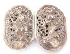 Pair of Far Eastern white metal belt buckles of pierced form decorated with deities, wt approx