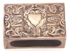 Late 19th/early 20th century silver matchbox cover decorated with mask and foliage detail, vacant