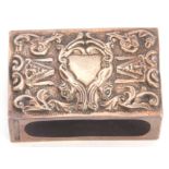 Late 19th/early 20th century silver matchbox cover decorated with mask and foliage detail, vacant