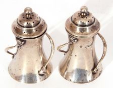 Pair of Edward VII peppers in Art Nouveau style of lighthouse form with ball finials to the domed