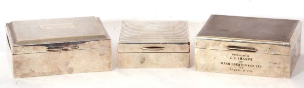 Mixed Lot: three silver mounted and wood lined cigarette boxes of hinged form, decorated with
